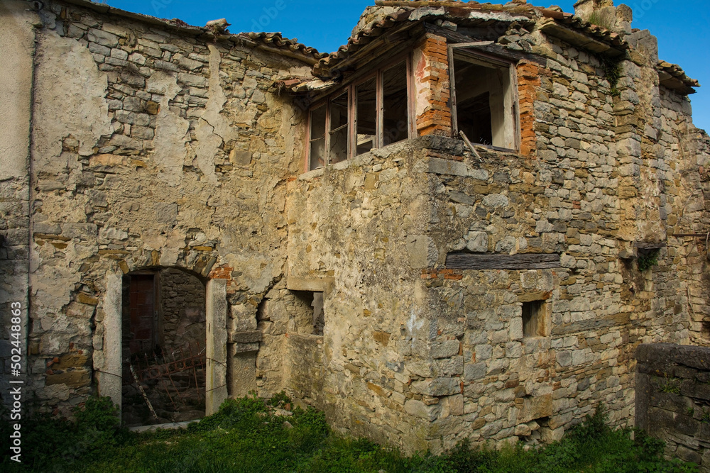An old derelict residential building in the historic medieval hill village of Buzet in Istria, western Croatia
