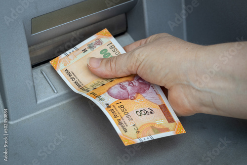 фотографія Indian rupees withdrawn from the ATM, Financial and economic concept related to
