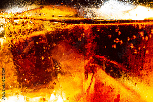 macro cola texture,cola with ice food background, cola close-up, design element. beer macro bubbles, ice, bubble, background, ice cubes, abstract backgrounds