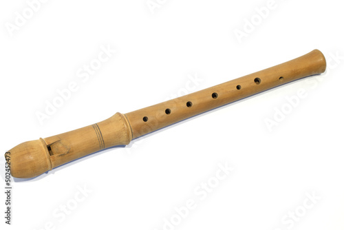 Single brown wooden flute. Wind musical instrument, melody control with finger isolated on the white background. Mouthpiece instrumental music