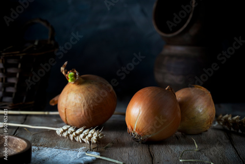 Yellow onion on a rustic table