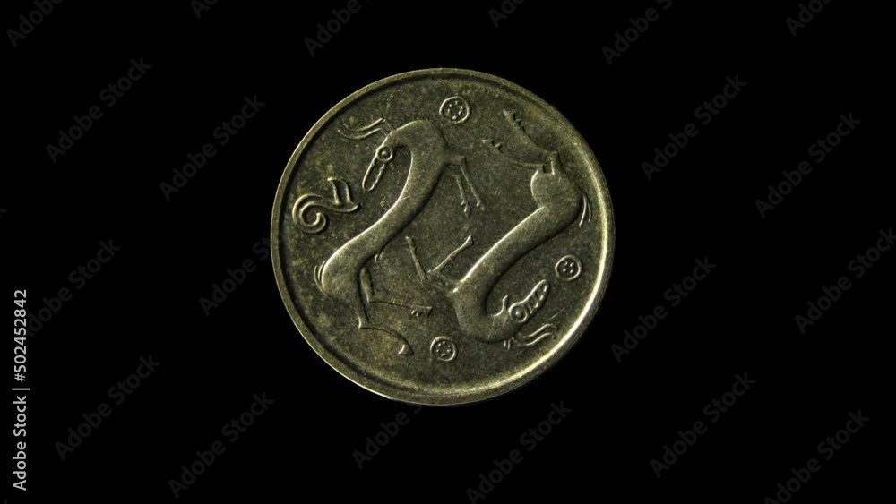 Reverse of Cyprus coin 2 cents 1998 isolated in black background. Close up view. Reverse of Cyprus coin 2 cents 1998 isolated in black background. Close up view.