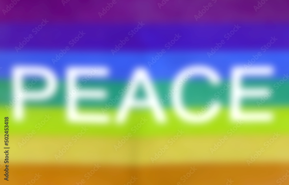 Intentionally blurred the text PEACE in the multicolored flag