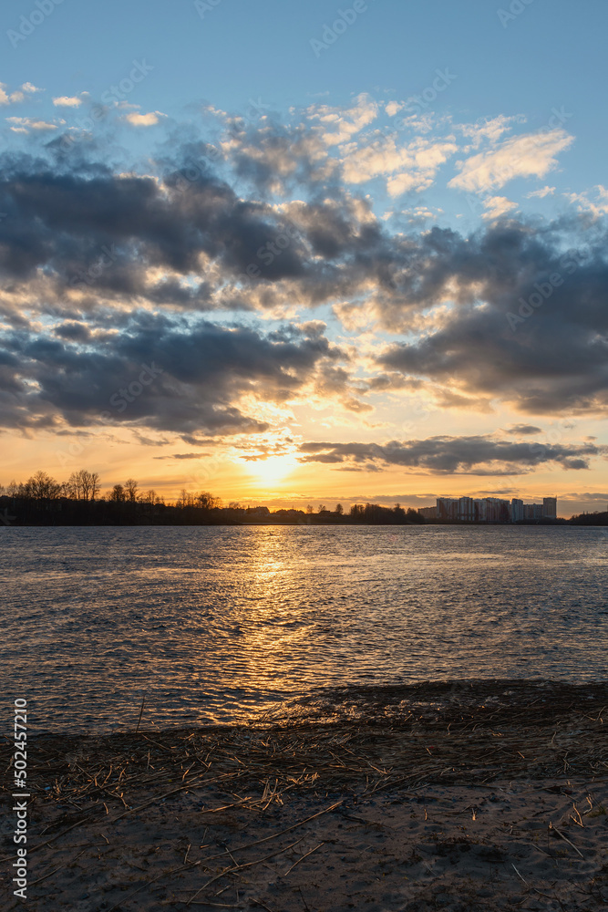 colorful sunset on the Neva River with a light path on the water at the end of a summer day colorful sunset on the Neva River with a light path on the water at the end of a summer day