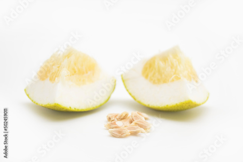 ripe pomelos and pomelos seeds slice on white background