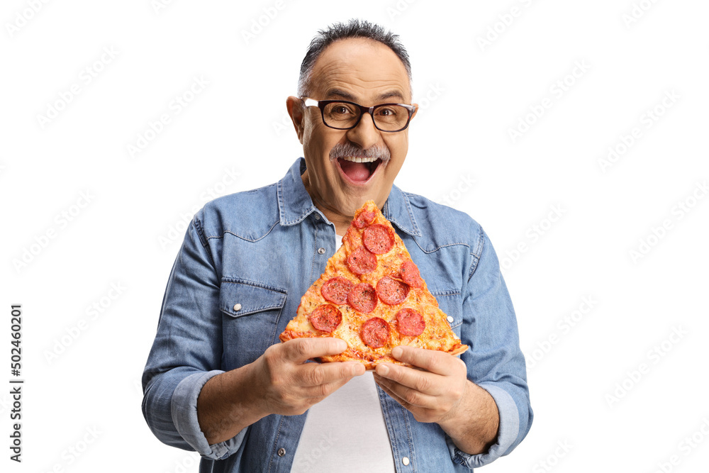 Cheerful mature man eating pepperoni pizza and looking at camera