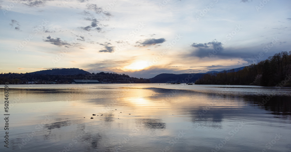 Panoramic View of a Canadian Landscape in Shoreline Trail, Port Moody, Greater Vancouver, British Columbia, Canada. Park in a Modern City during a colorful Sunset Sky. Nature Background Panorama