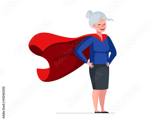 Older woman in superhero costume wearing red cape. Super heroine elderly female. Strong healthy old lady. Cool hero retired granny. Cheerful senior pensioner having superpowers. Active fun grandmother
