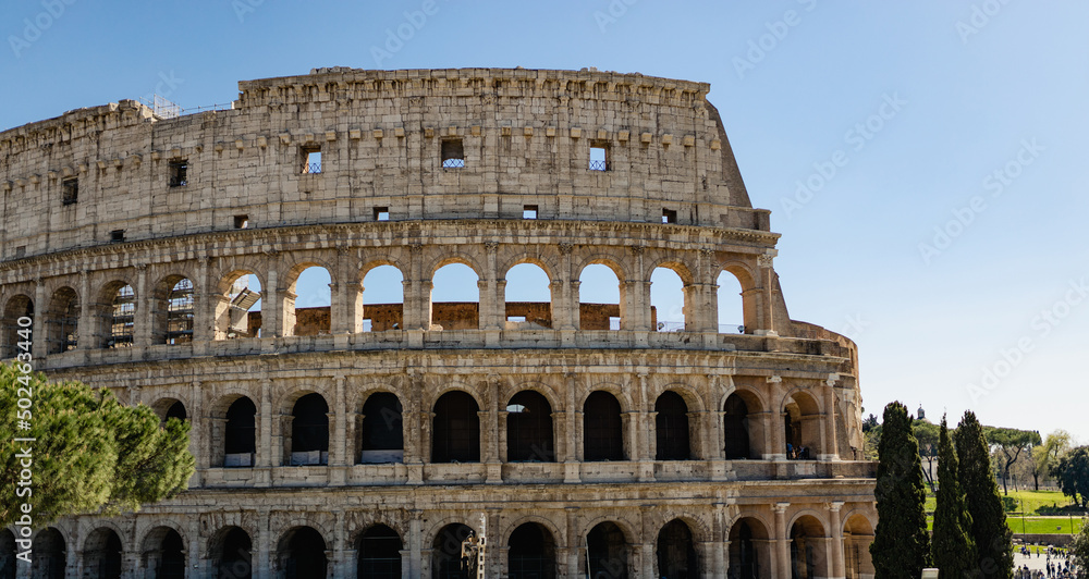 Great Roman Colosseum, Coliseum, Colosseo, also known as the Flavian Amphitheatre. Famous world landmark. Scenic urban landscape. Rome, Italy