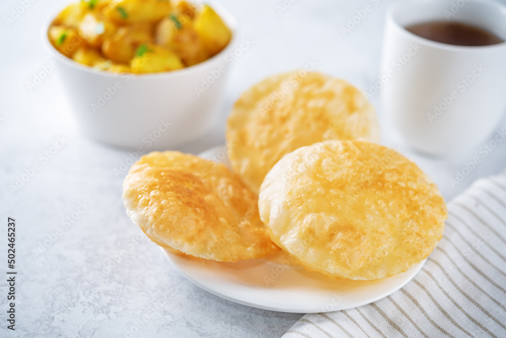 Indian poori, puri. Traditional puffed bread Indian poori, puri. Traditional puffed bread