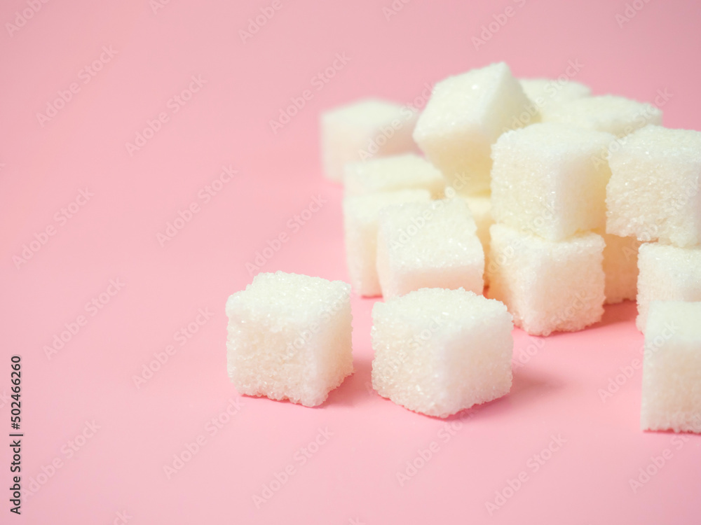 sugar cubes on isolated pink background sugar cubes on isolated pink background
