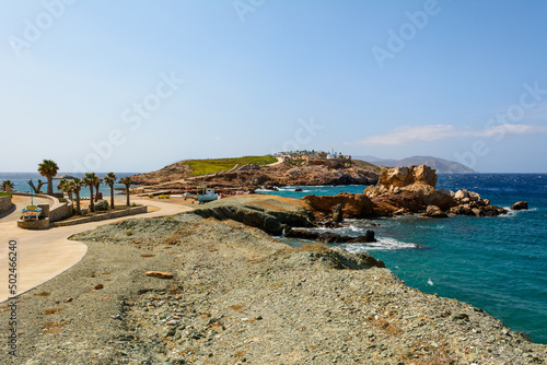 Koumbara beach located in a rocky bay on Ios Island. Greece photo