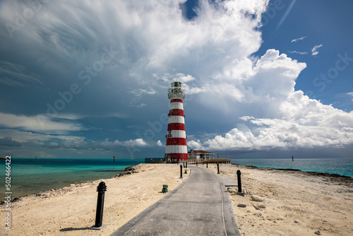 Footpath on a beach leading to lighthouse on a tropical, Caribbean island