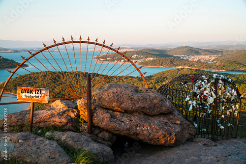 Devil's Table ( Seytan Sofrasi ), Ayvalik.  Place with an inscription: footprint, iron fence with masks tied on it