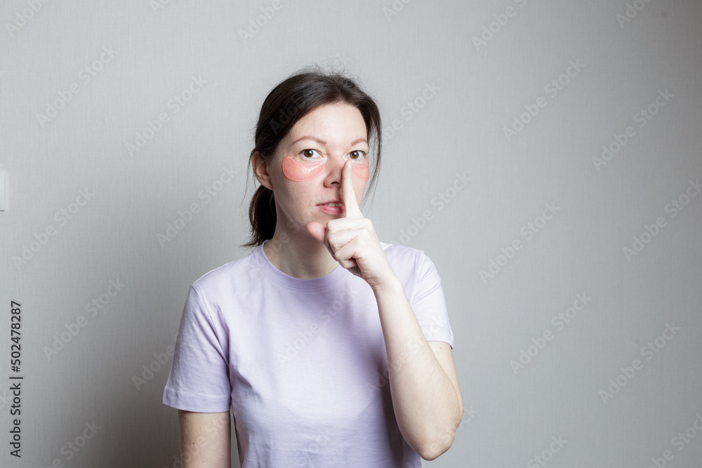 beautiful girl makes a cosmetic procedure. The girl uses eye patches. Skin care under the eyes. beautiful girl makes a cosmetic procedure. The girl uses eye patches. Skin care under the eyes.