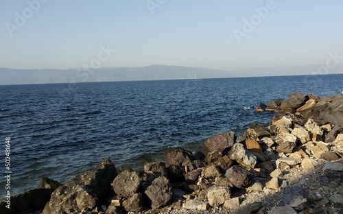 sunset, blue sea and rocks