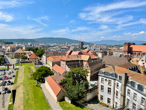 Wide shot aerial view of the city of Belfort (France), a beautiful sunny summer day, from the terraces of the citadel photo
