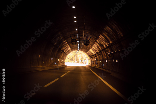 The Marão Tunnel is a road tunnel located in Portugal that connects Amarante with Vila Real, crossing the Serra do Marão. - Hope concept, the light at the end of the tunnel. photo