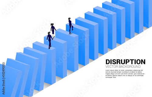 Silhouette of businessman and businesswoman walking on domino collapse. Concept of business industry disrupt