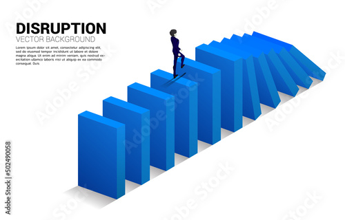 Silhouette of businessman walking on domino collapse. Concept of business industry disrupt