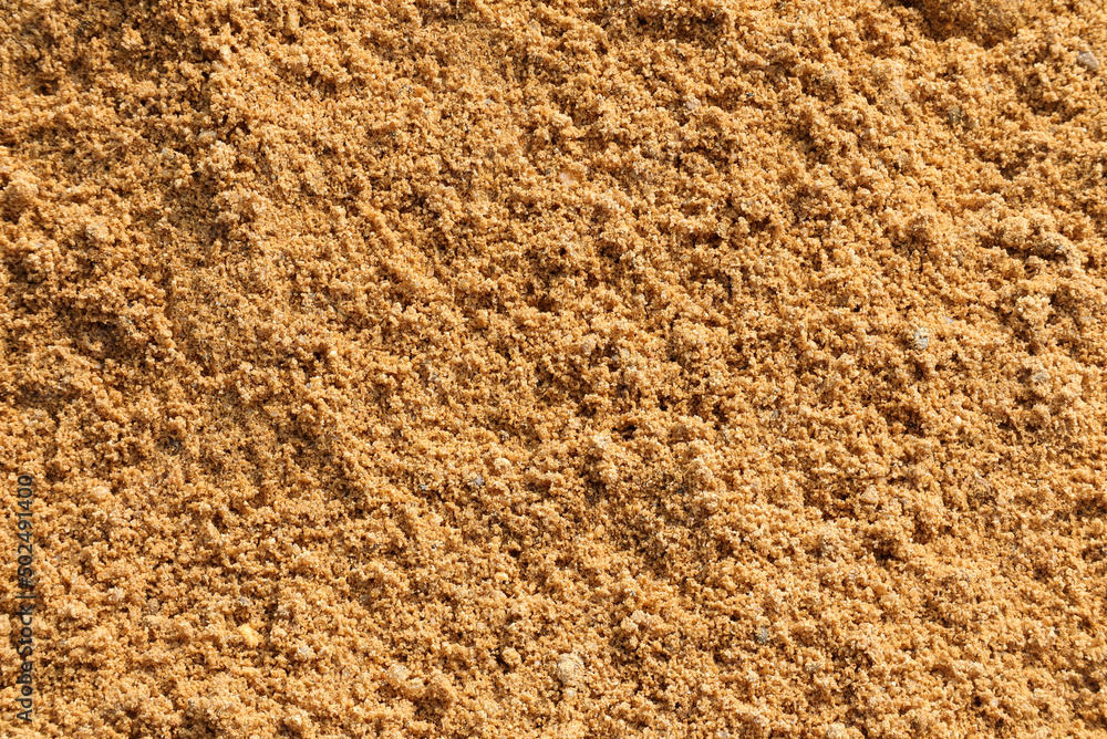 Closeup of sand for construction. piles of sand on a construction site. Closeup of sand for construction. piles of sand on a construction site.