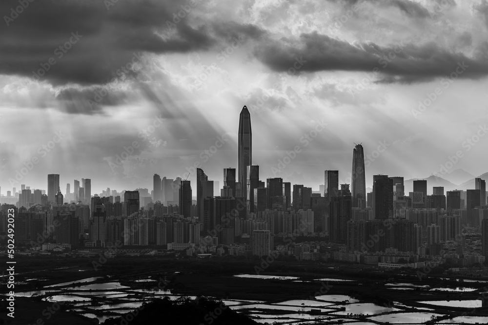 Silhouette of skyline of Shenzhen city, China under sunset. Viewed from Hong Kong border