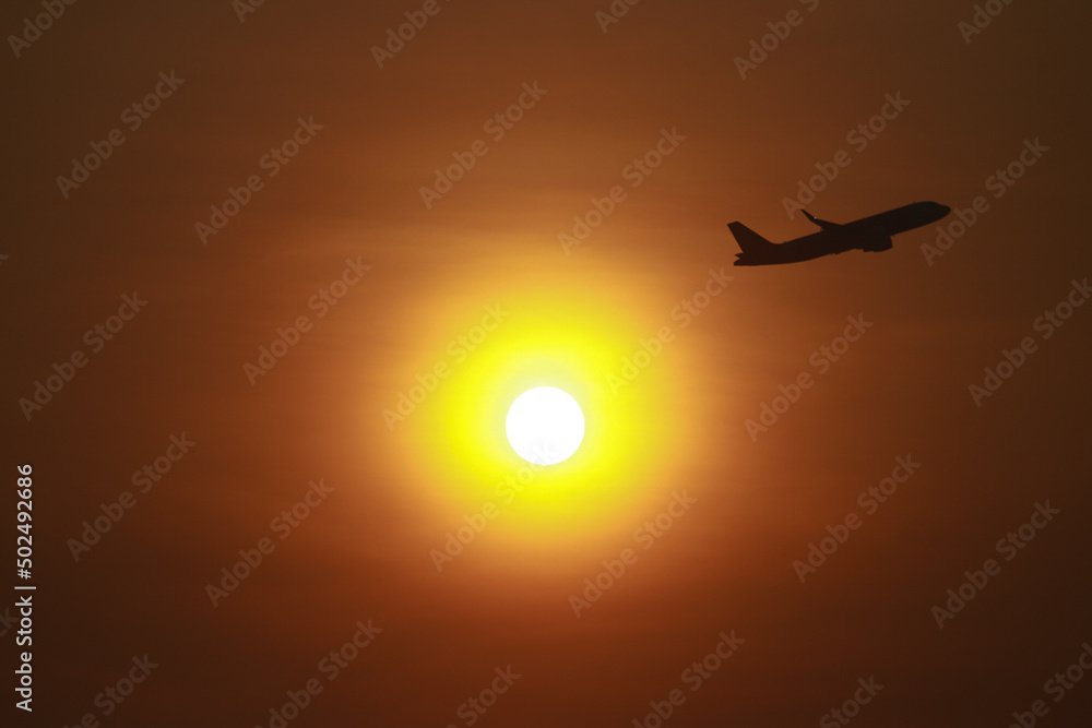Passenger planes take off during the daytime of holidays.
