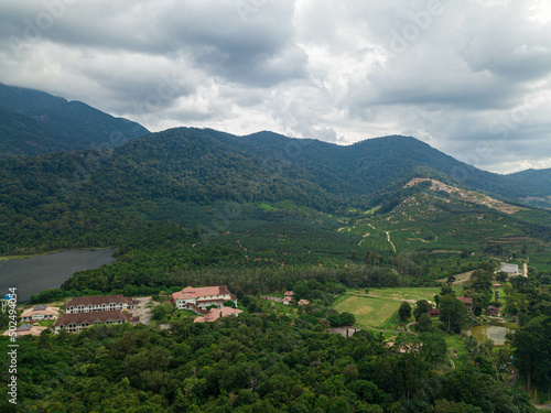 Aerial drone view of rural scenery with tropical trees in Mount Ledang National Park, Johor, Malaysia.