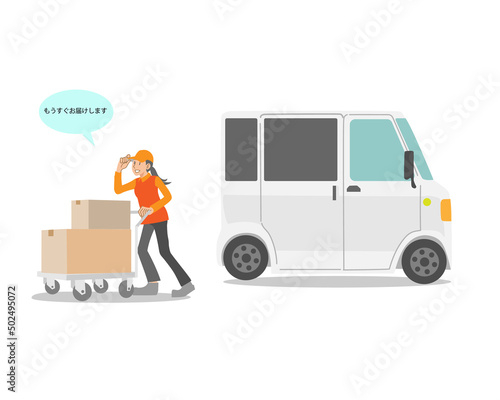 台車で荷物を配達する女性と配達用車両 photo