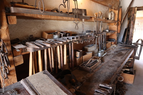 An old fashioned blacksmith's work station workroom 