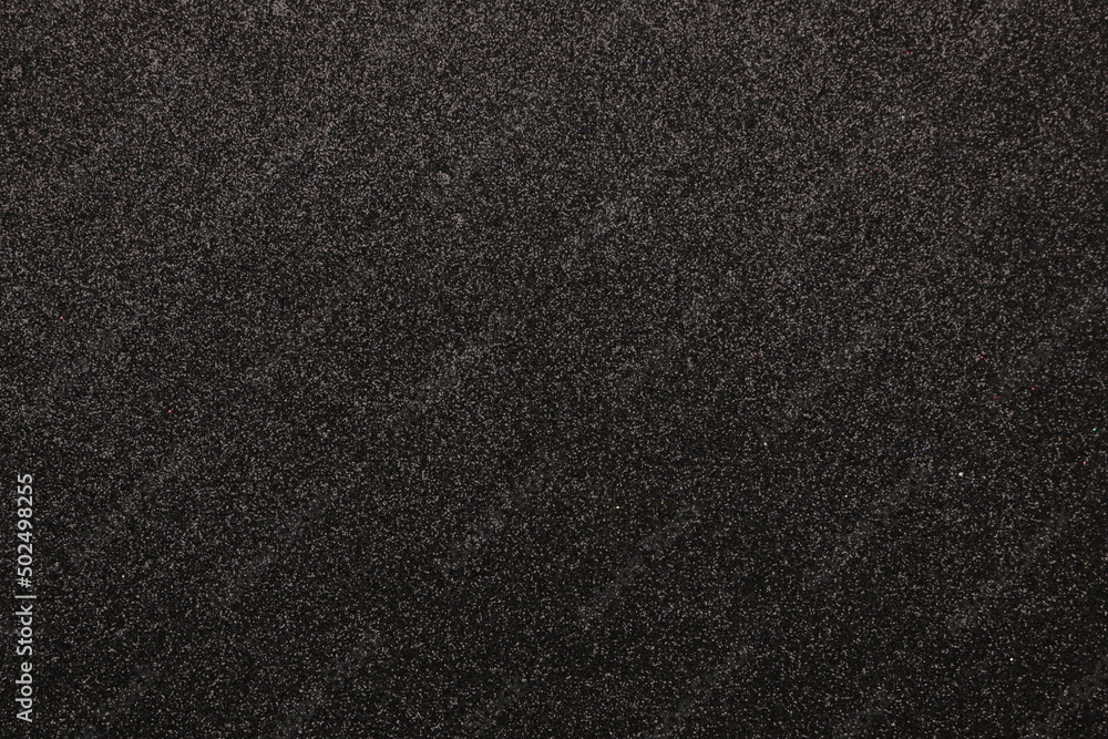 black background with textured surface