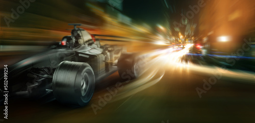 Modern fast racing car on night city street © Pixel-Shot