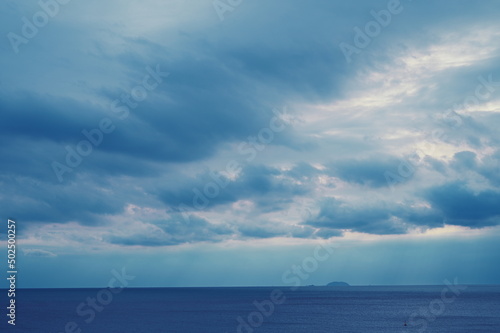 dark blue sea background  moody sky