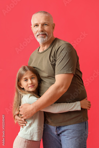 Little girl with her grandf...