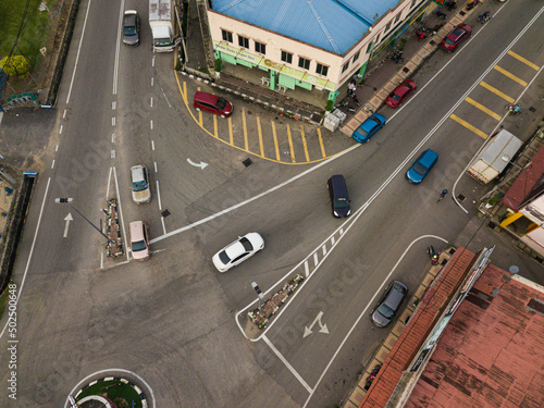 Aerial drone view of vehicles on the street from top view in Selandar, Jasin, Melaka, Malaysia. photo