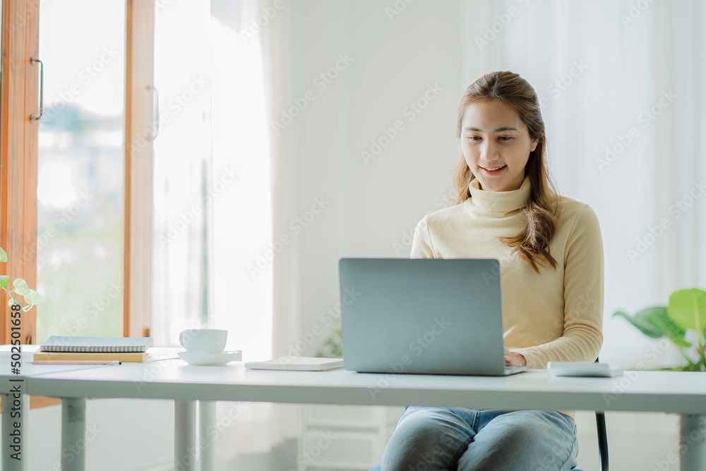 Asian woman working on virtual computer at desk Small business owners, people, employees, freelancers, online, SME, marketing, ecommerce, internet marketing concepts. Asian woman working on virtual computer at desk Small business owners, people, employees, freelancers, online, SME, marketing, ecommerce, internet marketing concepts.