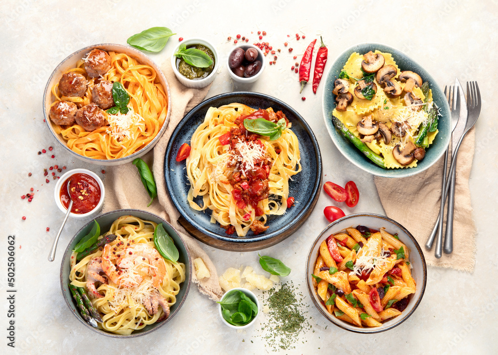 Italian pasta assortment on light background. Italian pasta assortment on light background.