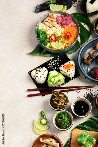 Japanese food assortment on light background.