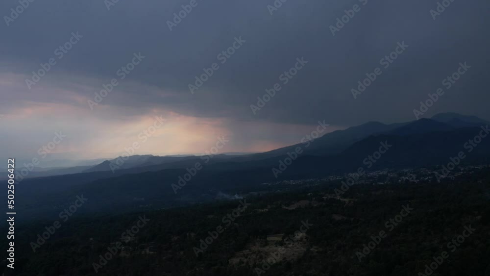 Front to back hyperlapse with view of mountains at a raining sunset Front to back hyperlapse with view of mountains at a raining sunset