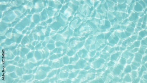 Water reflection background in the swimming pool.