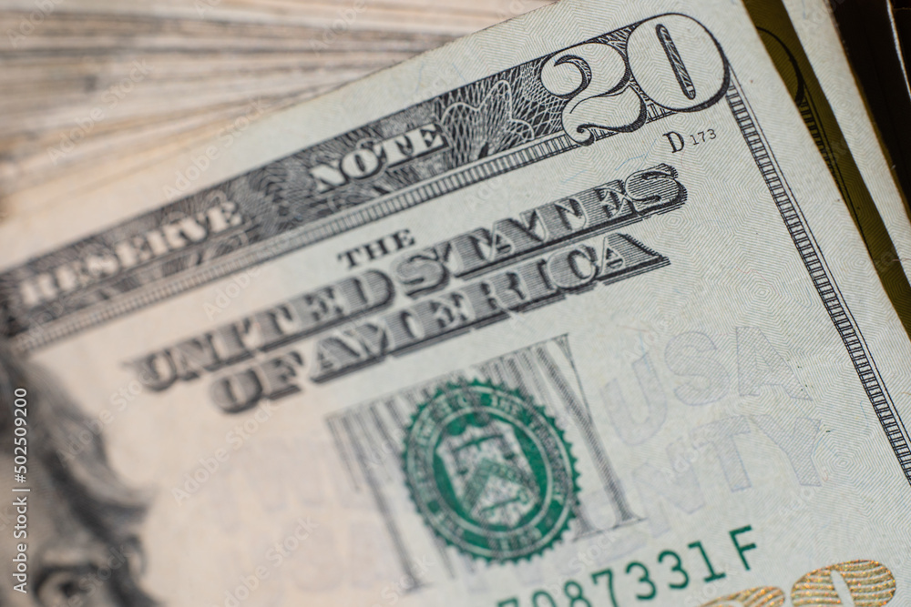 corner of banknote of stack of twenty dollars, close up, front side corner of banknote of stack of twenty dollars, close up, front side