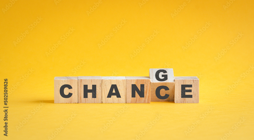 Wooden cube flip with word change to chance. Career growth and development concept. Wooden cube flip with word change to chance. Career growth and development concept.