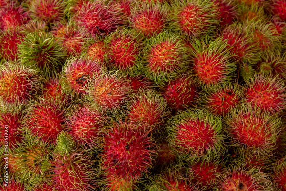 Fresh rambutan fruit bunch on local market in Thailand Fresh rambutan fruit bunch on local market in Thailand