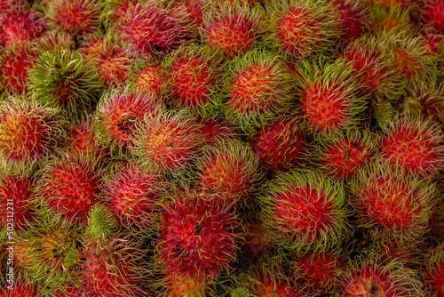 Fresh rambutan fruit bunch on local market in Thailand