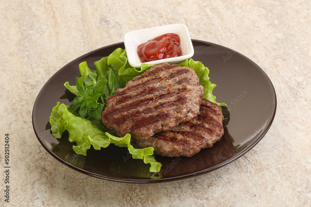Grilled beef burger cutlet with sauce Grilled beef burger cutlet with sauce