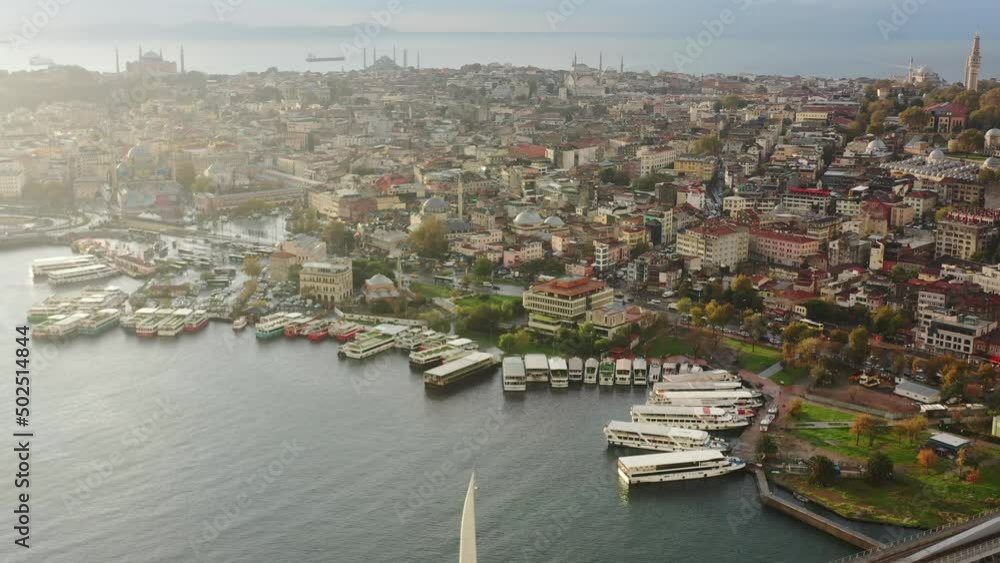 Aerial view of ferry boats docked on the Bosphorus River during a colorful and vibrant morning sunrise in Istanbul Turkey Aerial view of ferry boats docked on the Bosphorus River during a colorful and vibrant morning sunrise in Istanbul Turkey
