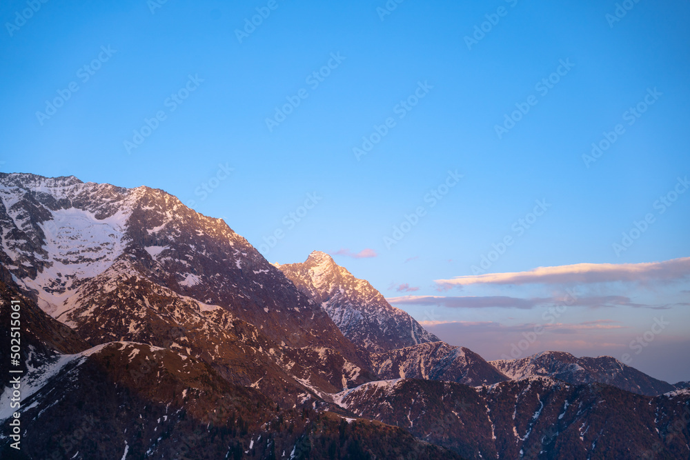 Sunset over the mountains in Triund, Himachal Pradesh, India.