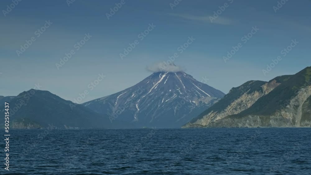 Vilyuchinski volcano and rocky coast of Kamchatka peninsula, Russia, 4k Vilyuchinski volcano and rocky coast of Kamchatka peninsula, Russia, 4k