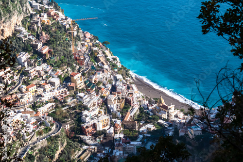 Panoramic aerial view from hiking trail leading to coastal town of Positano. Hiking in Lattari Mountains, Apennines, Amalfi Coast, Campania, Italy, Europe. Vacation at Tyrrhenian and Mediterranean Sea