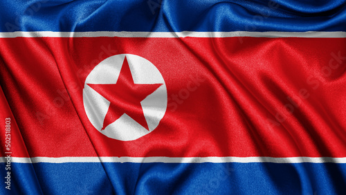 Free Download Close up realistic texture fabric textile silk satin flag of North Korea waving fluttering background. National symbol of the country. 9th of September, Happy Day concept
 - GFXLoad